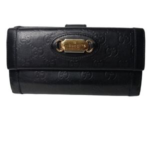 GUCCI Guccissima punch continental flap wallet black leather gold tone plate.